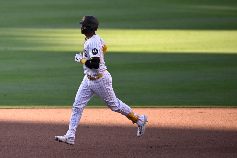 Jun 22, 2024; San Diego, California, USA; San Diego Padres catcher Kyle Higashioka (left) rounds the bases after hitting a two-run home run against the Milwaukee Brewers during the seventh inning at Petco Park. Mandatory Credit: Orlando Ramirez-USA TODAY Sports