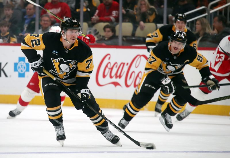 Nov 13, 2024; Pittsburgh, Pennsylvania, USA;  Pittsburgh Penguins left wing Anthony Beauvillier (72) skates with the puck against the Detroit Red Wings during the third period at PPG Paints Arena. Mandatory Credit: Charles LeClaire-Imagn Images