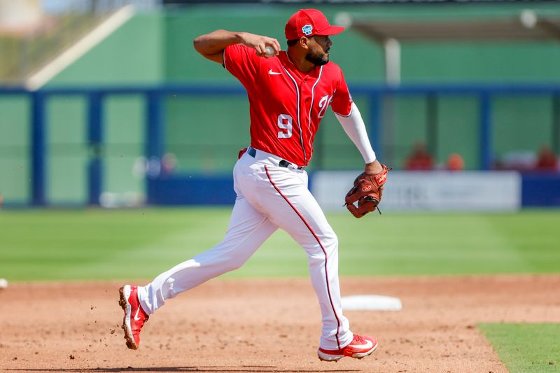 Mar 2, 2023; West Palm Beach, Florida, USA;  Washington Nationals third baseman Jeimer Candelario (9) throws to first base to take out Miami Marlins designated hitter Avisail Garcia (not pictured) during the third inning at The Ballpark of the Palm Beaches. Mandatory Credit: Sam Navarro-USA TODAY Sports