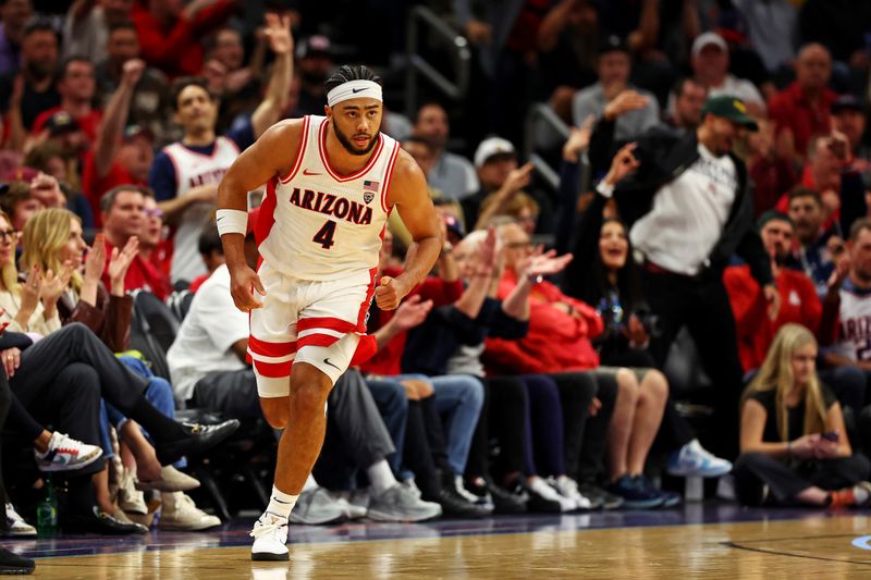 Dec 20, 2023; Phoenix, Arizona, USA; Arizona Wildcats guard Kylan Boswell (4) reacts after a play during the first half of the game against the Alabama Crimson Tide in the Hall of Fame Series at Footprint Center. Mandatory Credit: Mark J. Rebilas-USA TODAY Sports