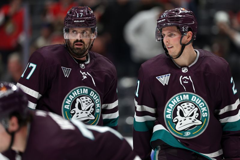 Mar 6, 2024; Anaheim, California, USA;  Anaheim Ducks left wing Alex Killorn (17) talks with center Isac Lundestrom (21) during the third period against the Ottawa Senators at Honda Center. Mandatory Credit: Kiyoshi Mio-USA TODAY Sports