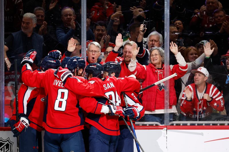 Nov 13, 2024; Washington, District of Columbia, USA; Washington Capitals center Dylan Strome (17) celebrates with teammates after scoring a goal against the Toronto Maple Leafs in the first period at Capital One Arena. Mandatory Credit: Geoff Burke-Imagn Images