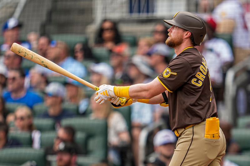 May 25, 2025; Cumberland, Georgia, USA; San Diego Padres second baseman Jake Cronenworth (9) watches after hitting a home run against the Atlanta Braves during the seventh inning at Truist Park. Mandatory Credit: Dale Zanine-Imagn Images