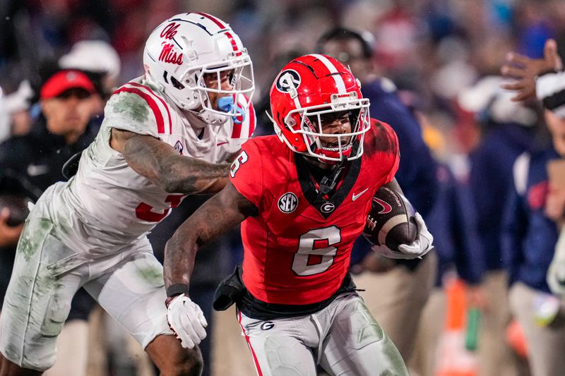 Nov 11, 2023; Athens, Georgia, USA; A Georgia Bulldogs wide receiver Dominic Lovett (6) is pushed out of bounds by Mississippi Rebels safety Daijahn Anthony (3) during the second half at Sanford Stadium. Mandatory Credit: Dale Zanine-USA TODAY Sports