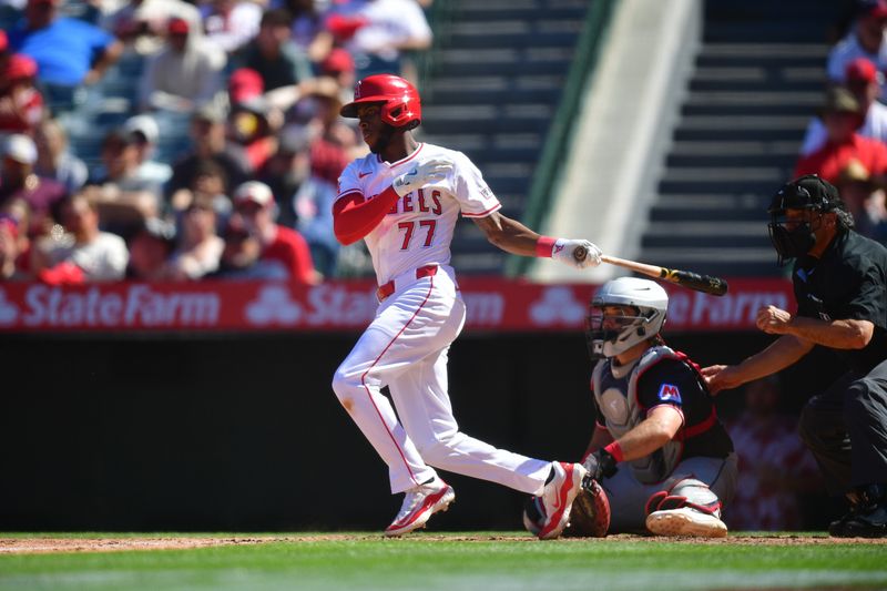 Apr 6, 2025; Anaheim, California, USA; Los Angeles Angels shortstop Tim Anderson (77) reaches first on a fielders choice against the Cleveland Guardians during the seventh inning at Angel Stadium. Mandatory Credit: Gary A. Vasquez-Imagn Images