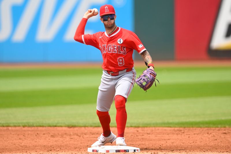 Jun 1, 2025; Cleveland, Ohio, USA; Los Angeles Angels shortstop Zach Neto (9) turns a double play in the third inning against the Cleveland Guardians at Progressive Field. Mandatory Credit: David Richard-Imagn Images