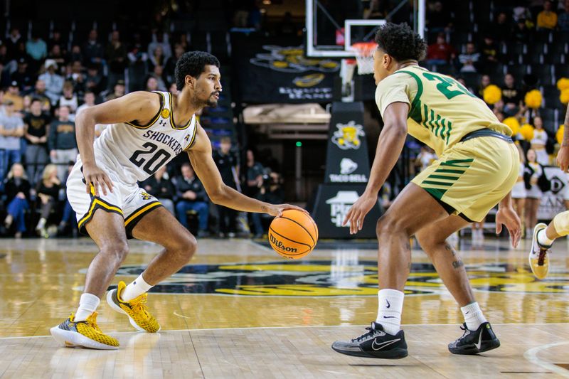 Jan 14, 2025; Wichita, Kansas, USA; Wichita State Shockers guard Harlond Beverly (20) looks to get around Charlotte 49ers guard Jaehshon Thomas (22) during the second half at Charles Koch Arena. Mandatory Credit: William Purnell-Imagn Images