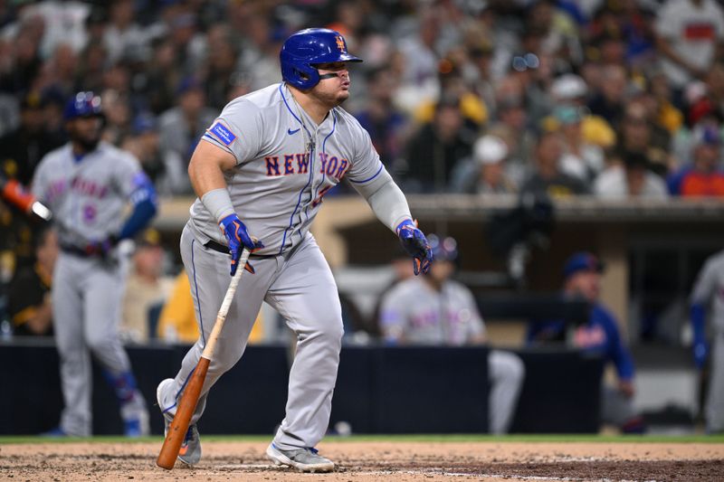 Jul 7, 2023; San Diego, California, USA; New York Mets designated hitter Daniel Vogelbach (32) hits an RBI single against the San Diego Padres during the fifth inning at Petco Park. Mandatory Credit: Orlando Ramirez-USA TODAY Sports