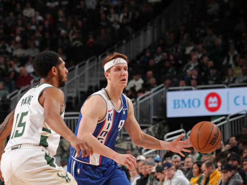 MILWAUKEE, WI - JANUARY 14: Kevin Huerter #9 of the Sacramento Kings dribbles the ball during the game against the Milwaukee Bucks on January 14, 2024 at the Fiserv Forum Center in Milwaukee, Wisconsin. NOTE TO USER: User expressly acknowledges and agrees that, by downloading and or using this Photograph, user is consenting to the terms and conditions of the Getty Images License Agreement. Mandatory Copyright Notice: Copyright 2024 NBAE (Photo by Gary Dineen/NBAE via Getty Images).