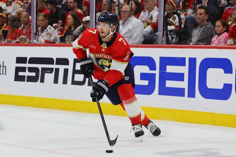 May 8, 2024; Sunrise, Florida, USA; Florida Panthers defenseman Dmitry Kulikov (7) moves the puck against the Boston Bruins during the second period in game two of the second round of the 2024 Stanley Cup Playoffs at Amerant Bank Arena. Mandatory Credit: Sam Navarro-USA TODAY Sports