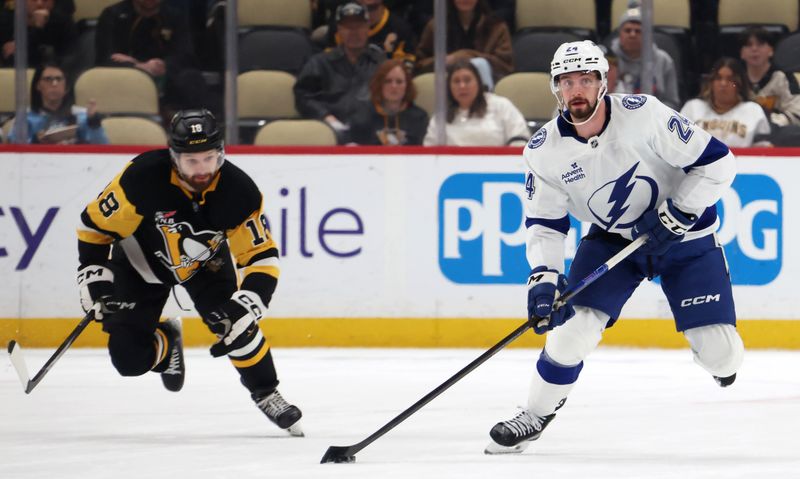 Jan 13, 2026; Pittsburgh, Pennsylvania, USA; Tampa Bay Lightning defenseman Max Crozier (24) moves the puck against Pittsburgh Penguins center Tommy Novak (18) during the first period at PPG Paints Arena. Mandatory Credit: Charles LeClaire-Imagn Images Jan 13, 2026; Pittsburgh, Pennsylvania, USA; Tampa Bay Lightning defenseman Max Crozier (24) moves the puck against Pittsburgh Penguins center Tommy Novak (18) during the first period at PPG Paints Arena. Mandatory Credit: Charles LeClaire-Imagn Images
