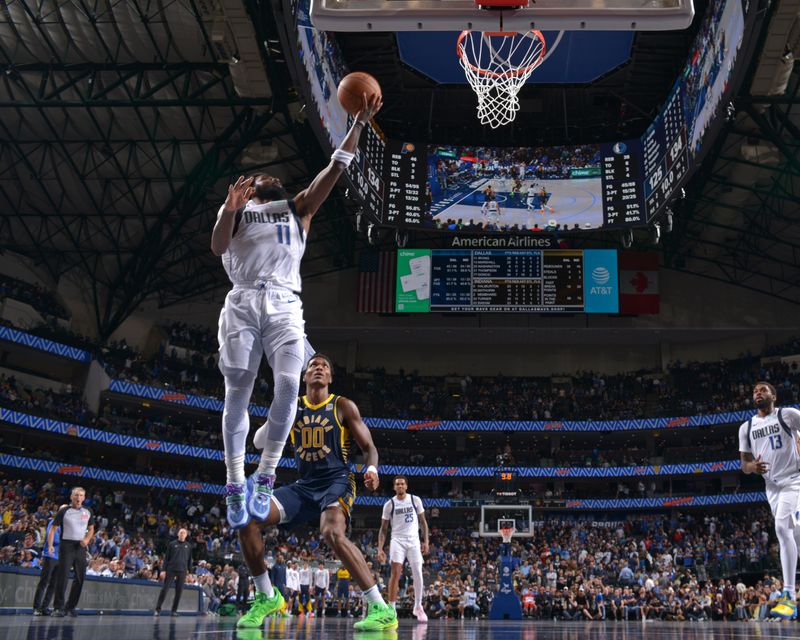 DALLAS, TX - NOVEMBER 4: Kyrie Irving #11 of the Dallas Mavericks drives to the basket during the game against the Indiana Pacers on November 4, 2024 at the American Airlines Center in Dallas, Texas. NOTE TO USER: User expressly acknowledges and agrees that, by downloading and or using this photograph, User is consenting to the terms and conditions of the Getty Images License Agreement. Mandatory Copyright Notice: Copyright 2024 NBAE (Photo by Glenn James/NBAE via Getty Images)