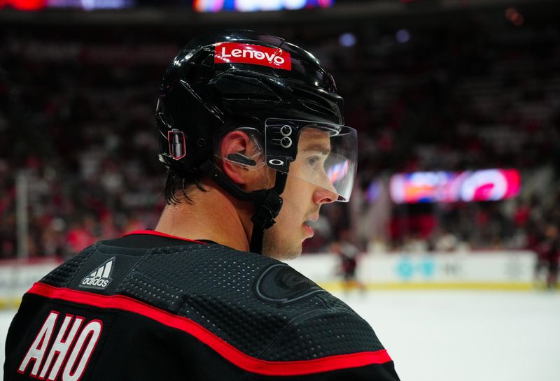 Apr 22, 2024; Raleigh, North Carolina, USA; Carolina Hurricanes center Sebastian Aho (20) looks on during the warmups against the New York Islanders in game two of the first round of the 2024 Stanley Cup Playoffs at PNC Arena. Mandatory Credit: James Guillory-USA TODAY Sports