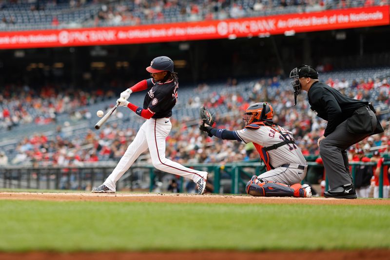 Apr 21, 2024; Washington, District of Columbia, USA; Washington Nationals shortstop CJ Abrams (5) singles against the Houston Astros during the first inning at Nationals Park. Mandatory Credit: Geoff Burke-USA TODAY Sports