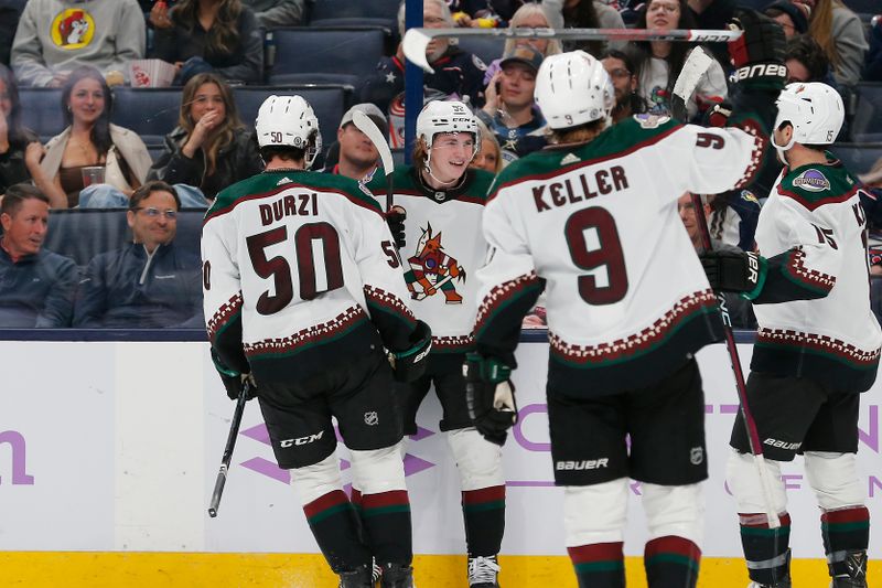 Nov 16, 2023; Columbus, Ohio, USA; Arizona Coyotes center Logan Cooley (92) celebrates his goal against the Columbus Blue Jackets during the third period at Nationwide Arena. Mandatory Credit: Russell LaBounty-USA TODAY Sports