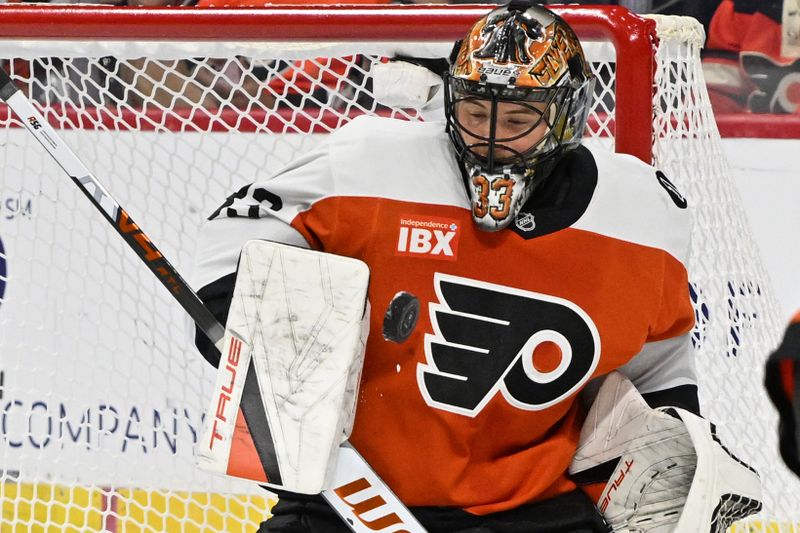 Oct 16, 2025; Philadelphia, Pennsylvania, USA; Philadelphia Flyers goaltender Samuel Ersson (33) makes a save against the Winnipeg Jets during the first period at Wells Fargo Center. Mandatory Credit: Eric Hartline-Imagn Images