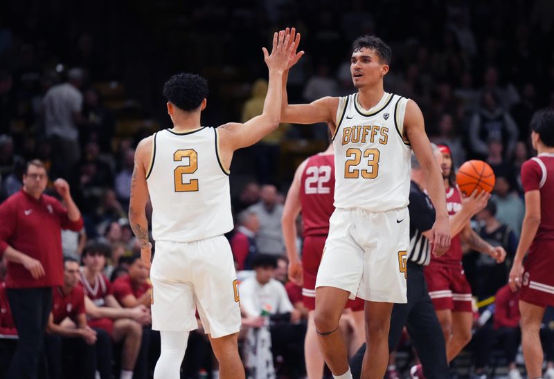 Mar 3, 2024; Boulder, Colorado, USA; Colorado Buffaloes guard KJ Simpson (2) and Colorado Buffaloes forward Tristan da Silva (23) celebrate a score in the second half against the Stanford Cardinal at the CU Events Center. Mandatory Credit: Ron Chenoy-USA TODAY Sports