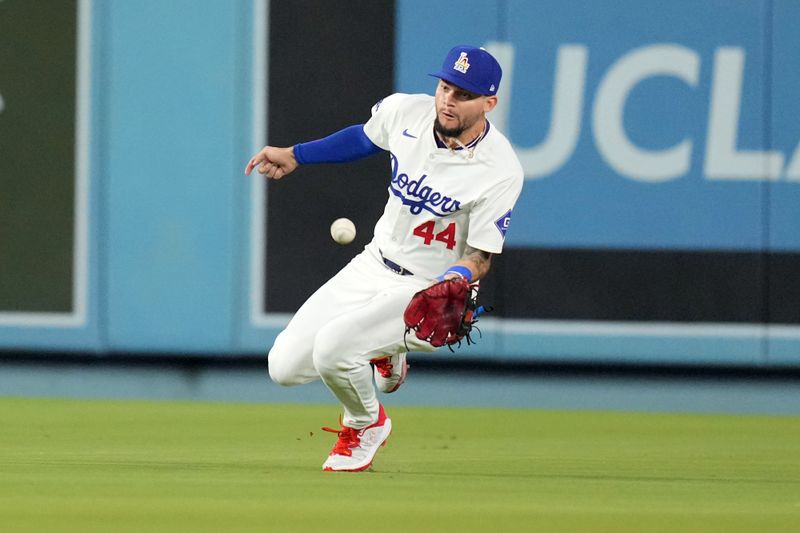 Jun 14, 2024; Los Angeles, California, USA; Los Angeles Dodgers center fielder Andy Pages (44) catches the ball in the seventh inning against the Kansas City Royals at Dodger Stadium. Mandatory Credit: Kirby Lee-USA TODAY Sports