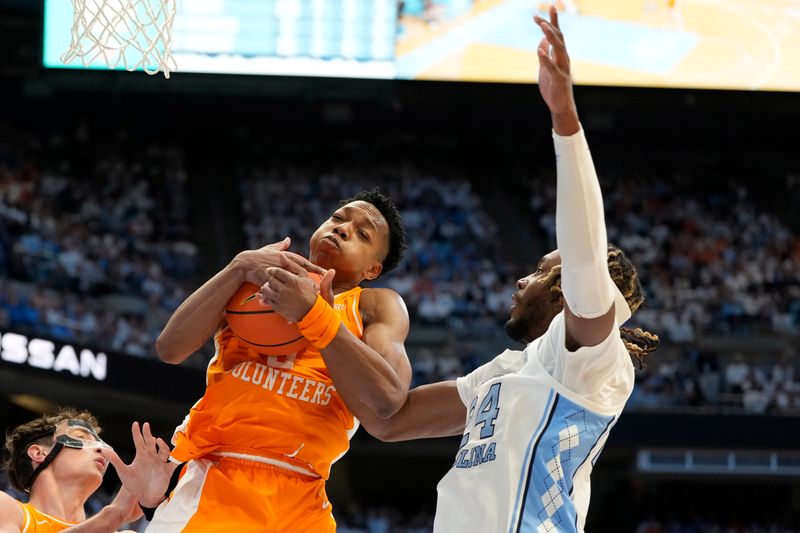 Nov 29, 2023; Chapel Hill, North Carolina, USA; Tennessee Volunteers guard Jordan Gainey (2) and North Carolina Tar Heels forward Jae'Lyn Withers (24) fight for the ball in the second half at Dean E. Smith Center. Mandatory Credit: Bob Donnan-USA TODAY Sports