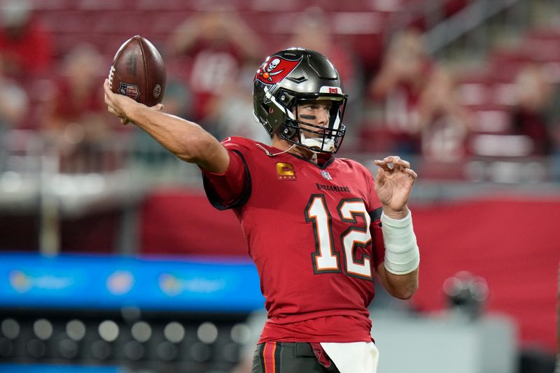 Tampa Bay Buccaneers quarterback Tom Brady (12) warms up before an NFL football game against the New Orleans Saints in Tampa, Fla., Monday, Dec. 5, 2022. (AP Photo/Chris O'Meara)