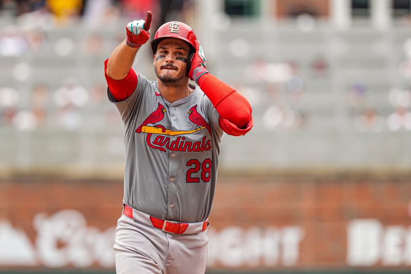 Jul 20, 2024; Cumberland, GA, USA; St. Louis Cardinals third baseman Nolan Arenado (28) reacts after hitting a home run against the Atlanta Braves during the seventh inning at Truist Park. Mandatory Credit: Dale Zanine-USA TODAY Sports