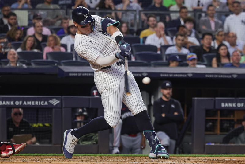 Jun 5, 2024; Bronx, New York, USA; New York Yankees center fielder Aaron Judge (99) hits a three RBI triple during the fifth inning against the Minnesota Twins at Yankee Stadium. Mandatory Credit: Vincent Carchietta-USA TODAY Sports