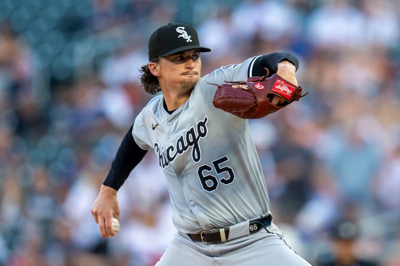 Aug 2, 2024; Minneapolis, Minnesota, USA; Chicago White Sox starting pitcher Davis Martin (65) delivers a pitch against the Minnesota Twins in the first inning at Target Field. Mandatory Credit: Jesse Johnson-USA TODAY Sports