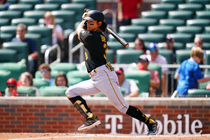 Sep 10, 2023; Cumberland, Georgia, USA; Pittsburgh Pirates second baseman Ji Hwan Bae (3) hits a single against the Atlanta Braves during the sixth inning at Truist Park. Mandatory Credit: John David Mercer-USA TODAY Sports