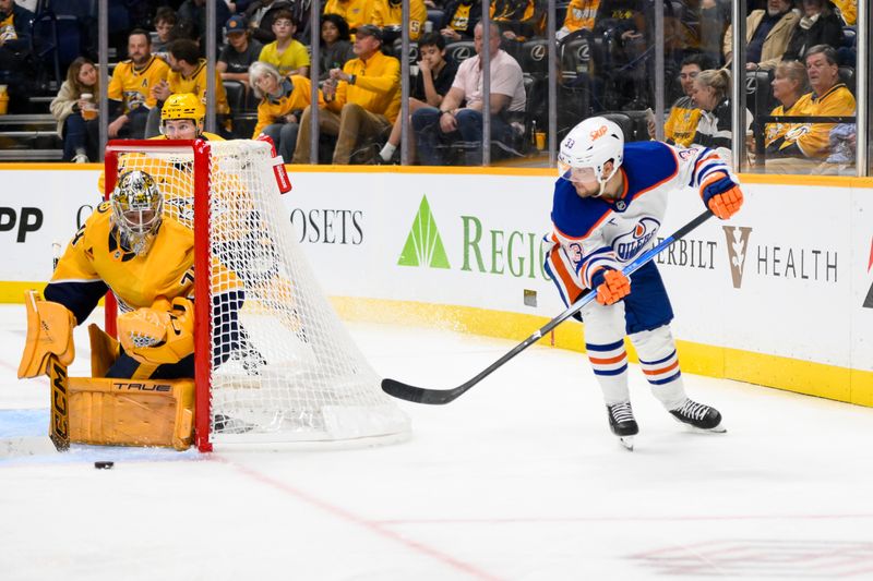 Oct 31, 2024; Nashville, Tennessee, USA; Edmonton Oilers left wing Viktor Arvidsson (33) skates behind the net against the Nashville Predators during the second period at Bridgestone Arena. Mandatory Credit: Steve Roberts-Imagn Images