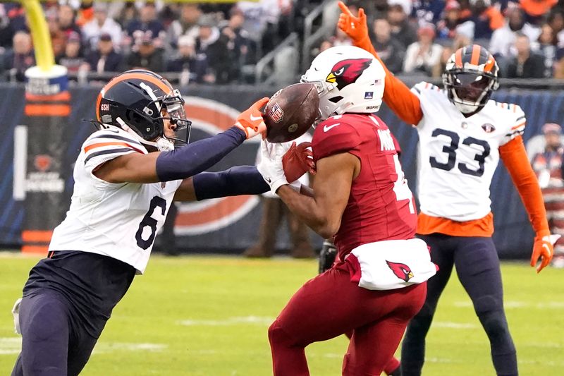 Chicago Bears cornerback Kyler Gordon (6) breaks up a pass intended for Arizona Cardinals wide receiver Rondale Moore during the first half of an NFL football game, Sunday, Dec. 24, 2023, in Chicago. (AP Photo/David Banks)