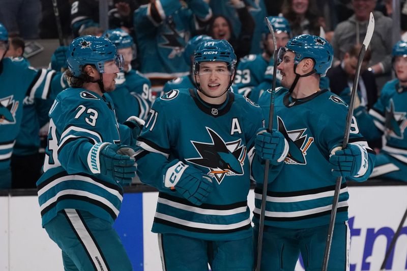 Mar 6, 2026; San Jose, California, USA; San Jose Sharks center Macklin Celebrini (71) scores a goal against the St. Louis Blues and celebrates with San Jose Sharks center Tyler Toffoli (73) and defenseman Dmitry Orlov (9) in the second period at SAP Center at San Jose. Mandatory Credit: David Gonzales-Imagn Images