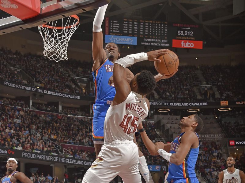 CLEVELAND, OH - JANUARY 8: Donovan Mitchell #45 of the Cleveland Cavaliers drives to the basket during the game against the Oklahoma City Thunder on January 8, 2025 at Rocket Mortgage FieldHouse in Cleveland, Ohio. NOTE TO USER: User expressly acknowledges and agrees that, by downloading and/or using this Photograph, user is consenting to the terms and conditions of the Getty Images License Agreement. Mandatory Copyright Notice: Copyright 2025 NBAE (Photo by David Liam Kyle/NBAE via Getty Images)