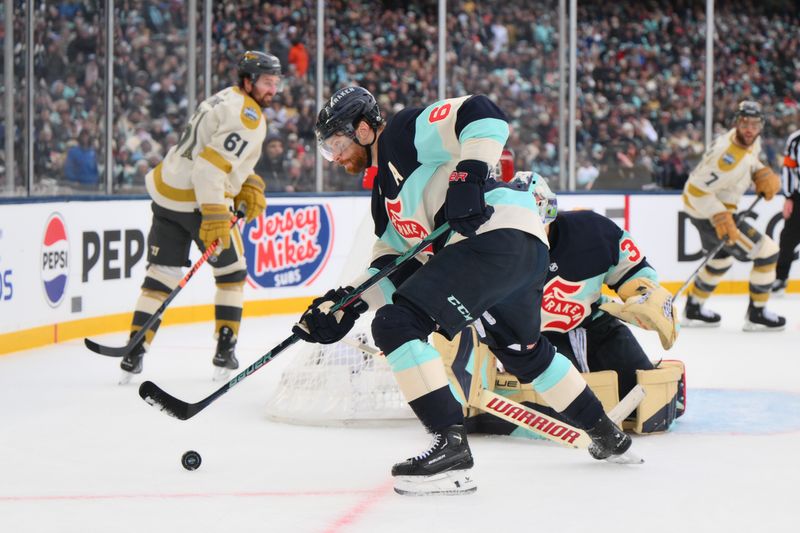 Jan 1, 2024; Seattle, Washington, USA; Seattle Kraken defenseman Adam Larsson (6) plays the puck during the 3rd period against the Vegas Golden Knights in the 2024 Winter Classic ice hockey game at T-Mobile Park. Mandatory Credit: Steven Bisig-USA TODAY Sports