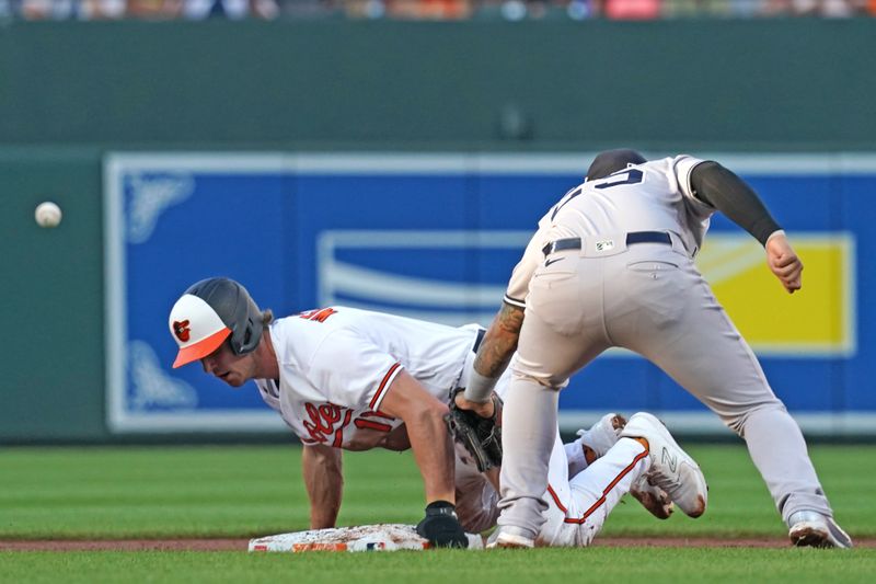 Jul 30, 2023; Baltimore, Maryland, USA; Baltimore Orioles second baseman Jordan Westburg (11) slides in safely with a first inning steal defended by New York Yankees second baseman Gleyber Torres (25) at Oriole Park at Camden Yards. Mandatory Credit: Mitch Stringer-USA TODAY Sports