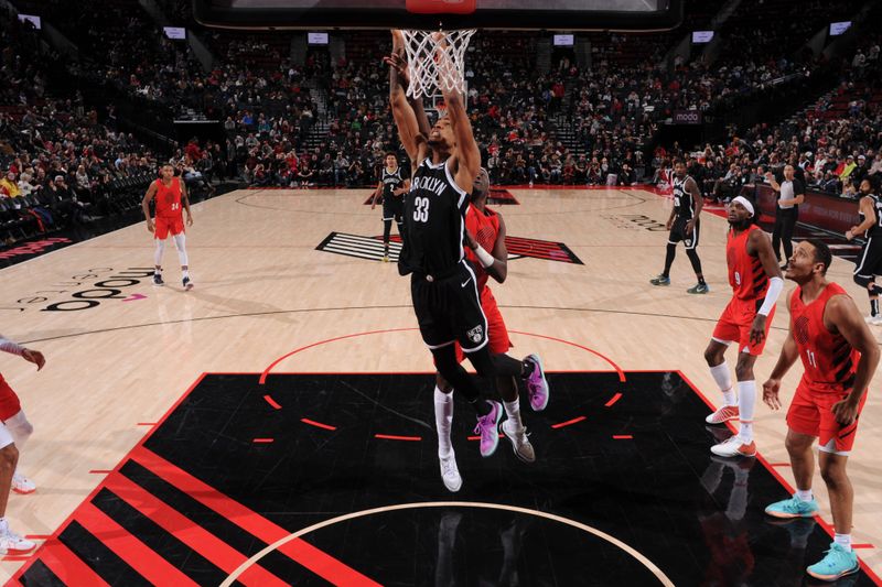 PORTLAND, OR - JANUARY 17: Nicolas Claxton #33 of the Brooklyn Nets drives to the basket during the game against the Portland Trail Blazers on January 17, 2024 at the Moda Center Arena in Portland, Oregon. NOTE TO USER: User expressly acknowledges and agrees that, by downloading and or using this photograph, user is consenting to the terms and conditions of the Getty Images License Agreement. Mandatory Copyright Notice: Copyright 2024 NBAE (Photo by Cameron Browne/NBAE via Getty Images)