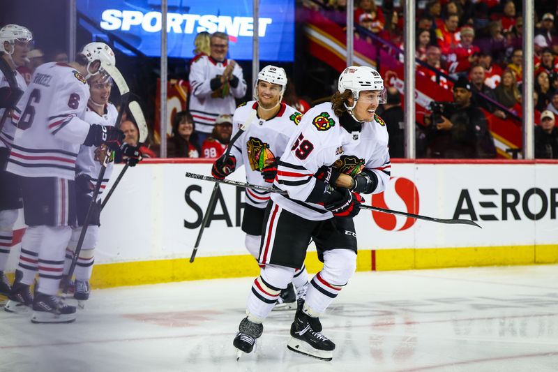 Nov 7, 2025; Calgary, Alberta, CAN; Chicago Blackhawks left wing Tyler Bertuzzi (59) celebrates his goal with teammates against the Calgary Flames during the third period at Scotiabank Saddledome. Mandatory Credit: Sergei Belski-Imagn Images