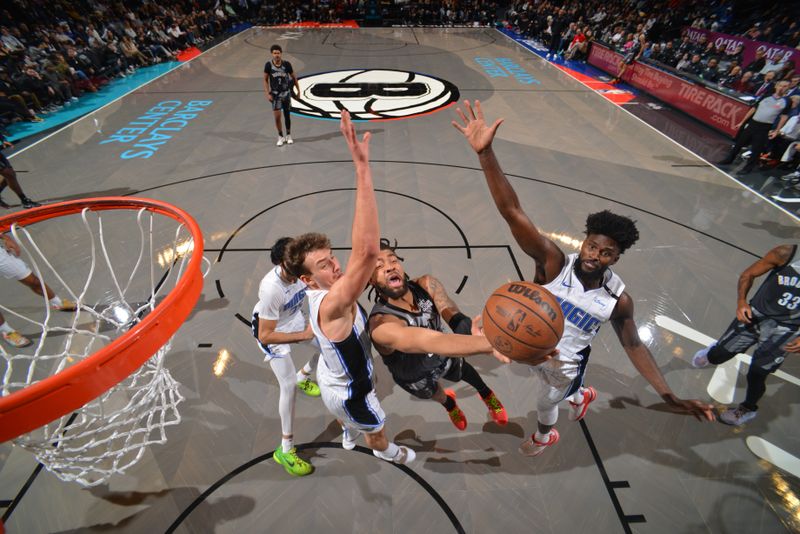 BROOKLYN, NY - DECEMBER 1: Trendon Watford #9 of the Brooklyn Nets drives to the basket during the game against the Orlando Magic on December 1, 2024 at Barclays Center in Brooklyn, New York. NOTE TO USER: User expressly acknowledges and agrees that, by downloading and or using this Photograph, user is consenting to the terms and conditions of the Getty Images License Agreement. Mandatory Copyright Notice: Copyright 2024 NBAE (Photo by Jesse D. Garrabrant/NBAE via Getty Images)