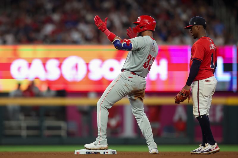 Jul 5, 2024; Atlanta, Georgia, USA; Philadelphia Phillies third baseman Edmundo Sosa (33) reacts after a double against the Atlanta Braves in the seventh inning at Truist Park. Mandatory Credit: Brett Davis-USA TODAY Sports