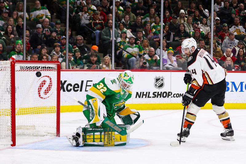 Jan 27, 2024; Saint Paul, Minnesota, USA; Minnesota Wild goaltender Filip Gustavsson (32) makes a save on a shot by Anaheim Ducks center Adam Henrique (14) during the second period at Xcel Energy Center. Mandatory Credit: Matt Krohn-USA TODAY Sports