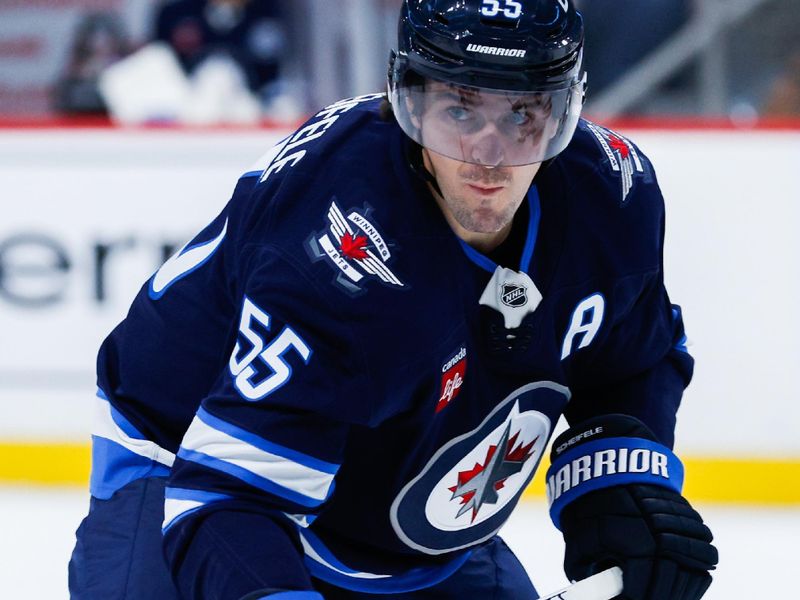Oct 30, 2025; Winnipeg, Manitoba, CAN;  Winnipeg Jets forward Mark Scheifele (55) awaits the face off against the Chicago Blackhawks during the second period at Canada Life Centre. Mandatory Credit: Terrence Lee-Imagn Images