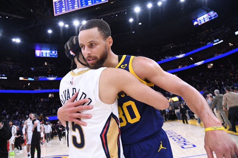 SAN FRANCISCO, CA - APRIL 12:  Jose Alvarado #15 of the New Orleans Pelicans & Stephen Curry #30 of the Golden State Warriors embrace after the game on April 12, 2024 at Chase Center in San Francisco, California. NOTE TO USER: User expressly acknowledges and agrees that, by downloading and or using this photograph, user is consenting to the terms and conditions of Getty Images License Agreement. Mandatory Copyright Notice: Copyright 2024 NBAE (Photo by Noah Graham/NBAE via Getty Images)