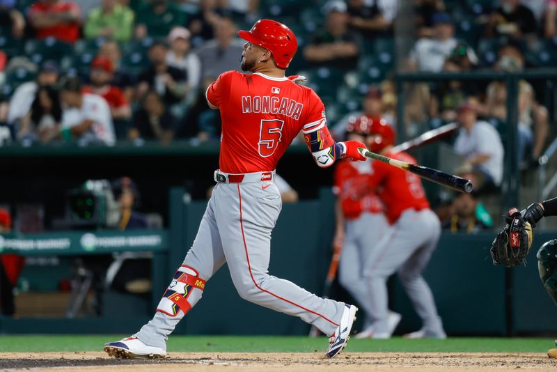 May 20, 2025; West Sacramento, California, USA; Los Angeles Angels third baseman Yoán Moncada (5) hits a three run home run during the fifth inning against the Athletics at Sutter Health Park. Mandatory Credit: Sergio Estrada-Imagn Images