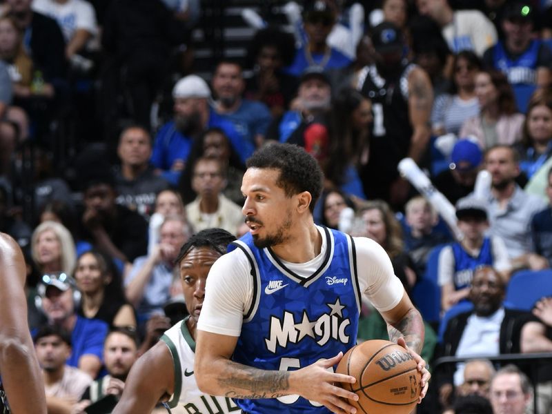 ORLANDO, FL - APRIL 14: Cole Anthony #50 of the Orlando Magic handles the ball during the game against the Milwaukee Bucks on April 14, 2024 at Kia Center in Orlando, Florida. NOTE TO USER: User expressly acknowledges and agrees that, by downloading and or using this photograph, User is consenting to the terms and conditions of the Getty Images License Agreement. Mandatory Copyright Notice: Copyright 2024 NBAE (Photo by Fernando Medina/NBAE via Getty Images)