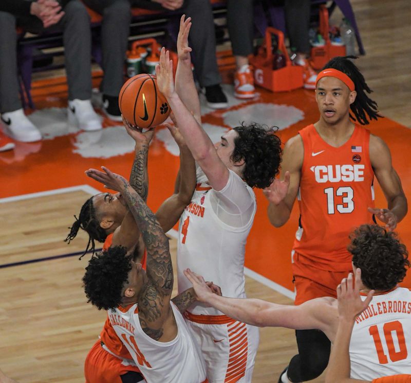 Feb 22, 2023; Clemson, South Carolina, USA; Syracuse guard Judah Mintz (3) has a shot blocked by Clemson sophomore forward Ian Schieffelin (4) during the first half at Littlejohn Coliseum. Mandatory Credit: Ken Ruinard-USA TODAY Sports