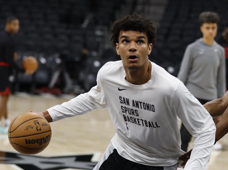 SAN ANTONIO, TX - NOVEMBER 30: Dominick Barlow #26 of the San Antonio Spurs dribbles during warmups before the game against the Atlanta Hawks at Frost Bank Center on November 30, 2023 in San Antonio, Texas. NOTE TO USER: User expressly acknowledges and agrees that, by downloading and or using this photograph, User is consenting to terms and conditions of the Getty Images License Agreement. (Photo by Ronald Cortes/Getty Images)