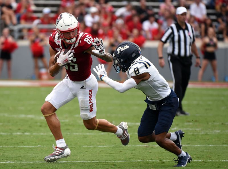 Sep 10, 2022; Raleigh, North Carolina, USA; North Carolina State Wolfpack wide receiver Anthony Smith (85) runs after a catch during the second half against the Charleston Southern Buccaneers at Carter-Finley Stadium. Mandatory Credit: Rob Kinnan-USA-TODAY Sports