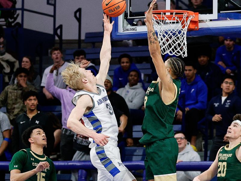 Mar 9, 2024; Colorado Springs, Colorado, USA; Air Force Falcons forward Rytis Petraitis (31) drives to the net against Colorado State Rams guard Nique Clifford (10) in the first half at Clune Arena. Mandatory Credit: Isaiah J. Downing-USA TODAY Sports