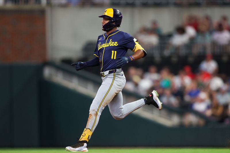 Aug 6, 2024; Atlanta, Georgia, USA; Milwaukee Brewers left fielder Jackson Chourio (11) takes second on an error against the Atlanta Braves in the eighth inning at Truist Park. Mandatory Credit: Brett Davis-USA TODAY Sports