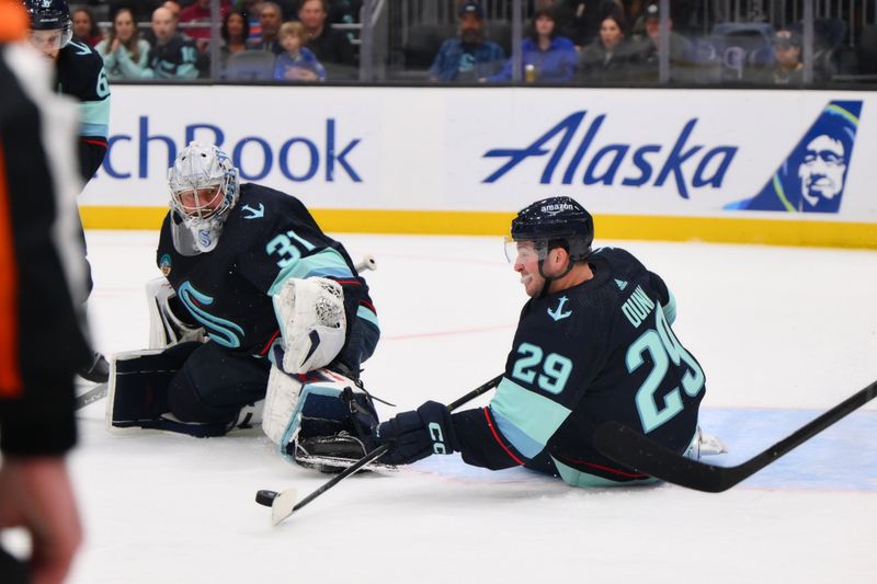 Mar 2, 2024; Seattle, Washington, USA; Seattle Kraken defenseman Vince Dunn (29) blocks a goal shot against the Edmonton Oilers during the third period at Climate Pledge Arena. Mandatory Credit: Steven Bisig-USA TODAY Sports