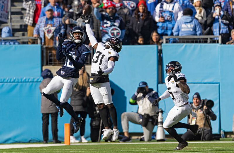 Jacksonville Jaguars cornerback Darious Williams (31) knocks a pass intended for Tennessee Titans wide receiver DeAndre Hopkins (10) away during their NFL football game Sunday, Jan. 7, 2024, in Nashville, Tenn. (AP Photo/Wade Payne)